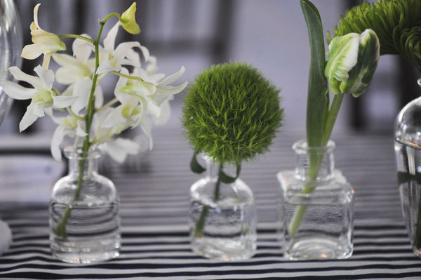 Tiny vases with a single flower