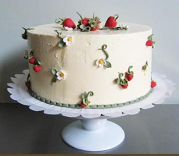 Simple wedding cake with gum paste strawberries and strawberry blossoms