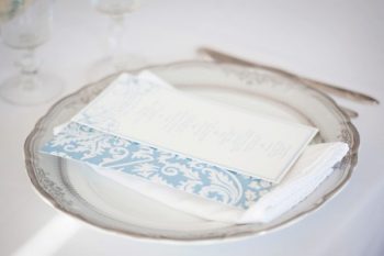 Blue damask invitations on vintage china plates