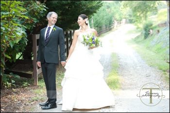 bride and groom on a country road