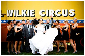 circus bride dances in front of bridal party