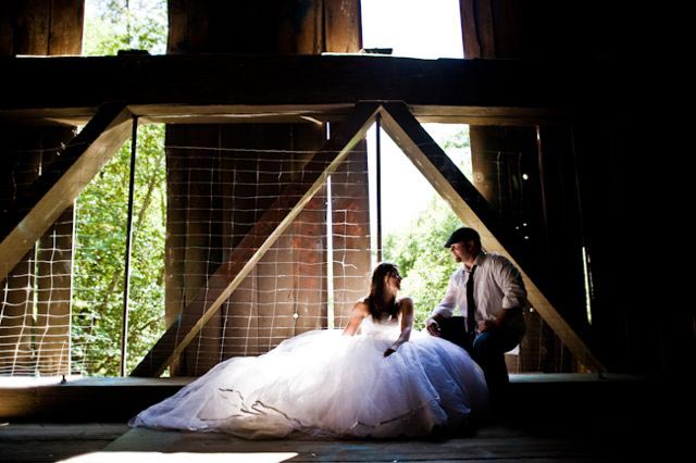 bride and groom in a rusic barn
