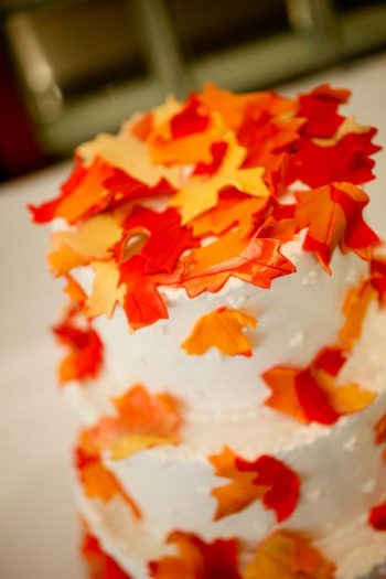 wedding cake with orange fondant leaves