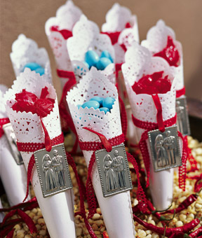 red and blue candy wrapped in a cone for wedding guests