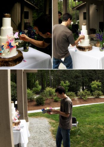 Groom decorates the wedding cake