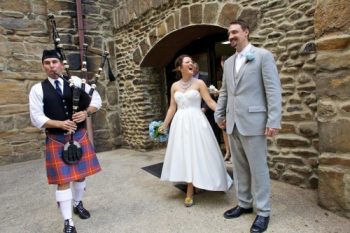 bride and groom with bag piper