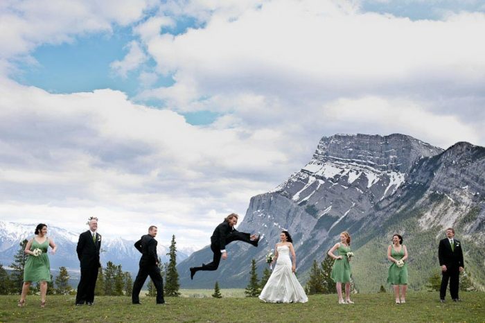 Mountain groom leaps for his bride