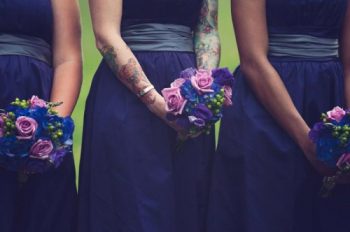 tattooed bridesmaid in a purple dress