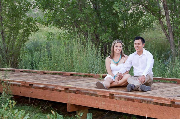 couple sits on a wooden bridge in Calico Basin, Las Vegas