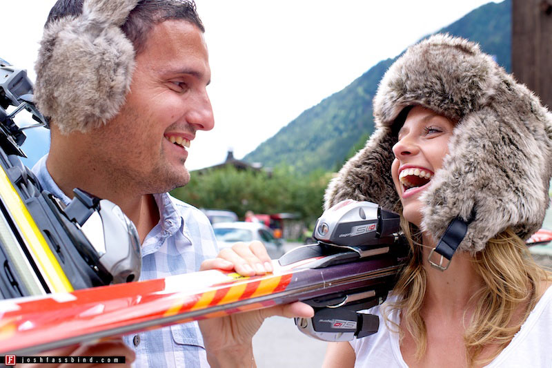 couple playing with skis and fur hats in summer