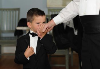 groom and ring bearer getting ready