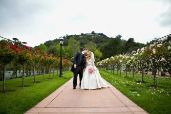 bride and groom in a garden in Malibu