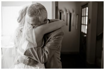 bride and father embrace