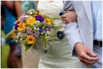 western maryland couple with wildflower bouquet and seersucker suit