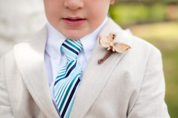 ring bearer with pinecone boutonniere