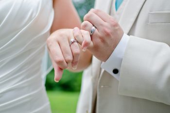 pinky embrace with wedding rings