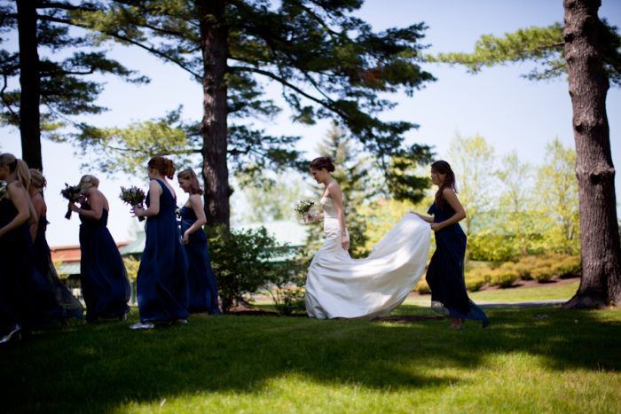bride walks across the lawn at the mount estate in Lenox
