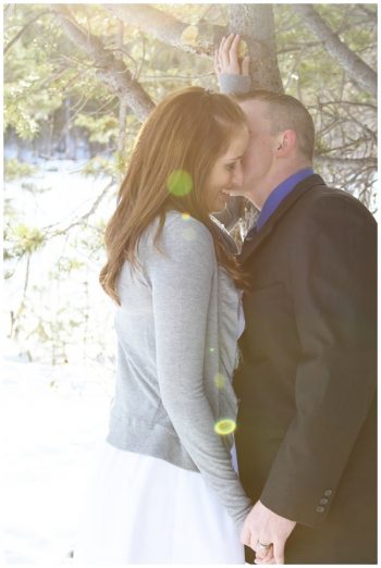 bride and groom kiss at big bear lake
