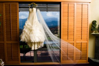Wedding dress hangins in front of mountains in Colorado Springs, CO