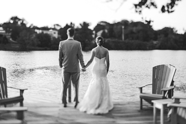 knoxville bride and groom holding hands at a lake
