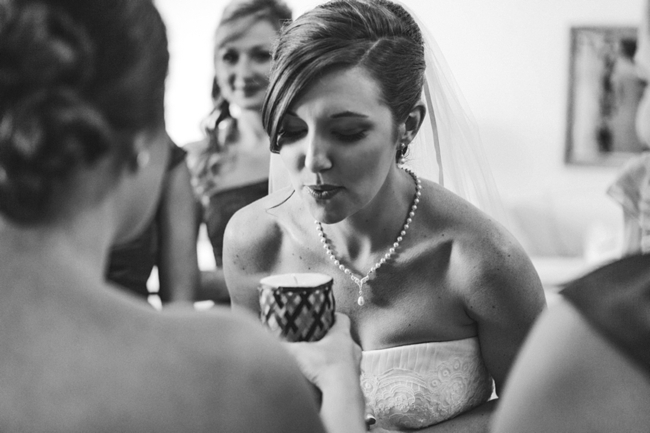 bride blows out a candle