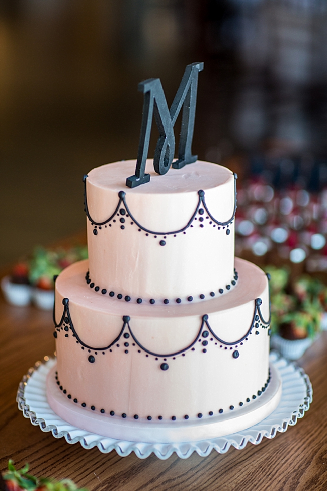 blush pink wedding cake with black monogram