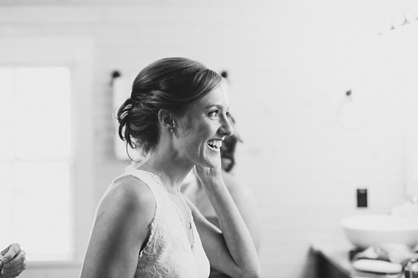 Black and white portrait of bride getting ready