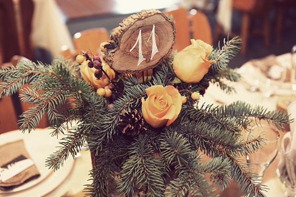 rustic pine. wood, and rose centerpieces