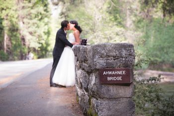Bride and Groom on Ahwanee bridge in Yosemite