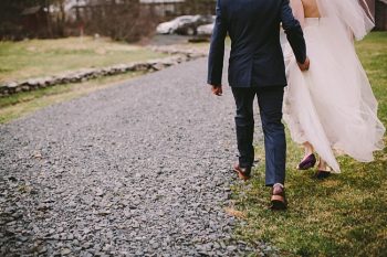 NY bride and groom walking away