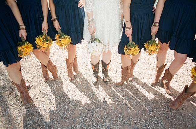 navy bridesmaid dresses with yellow bouquets by Gaby J Photography