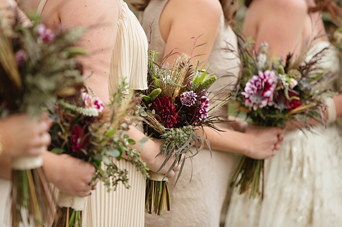 red, purple, and green rustic elegant bridesmaids bouquets  from https://mountainsidebride.com