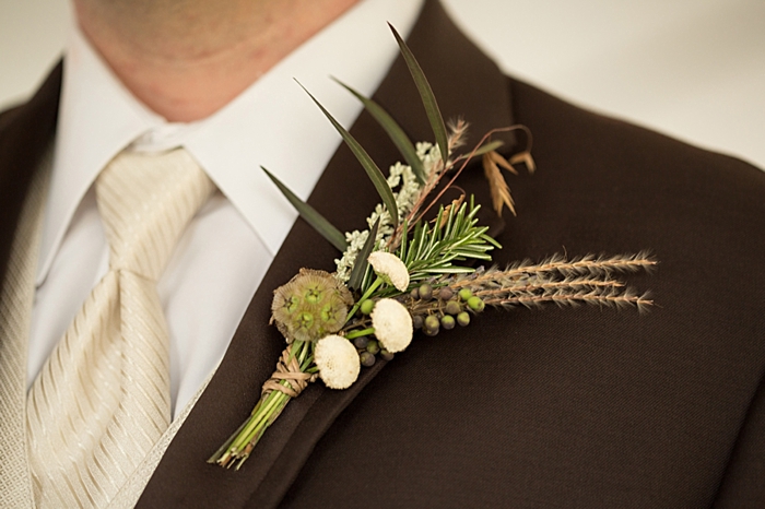 rustic elegant boutonniere with feathers  more on https://mountainsidebride.com