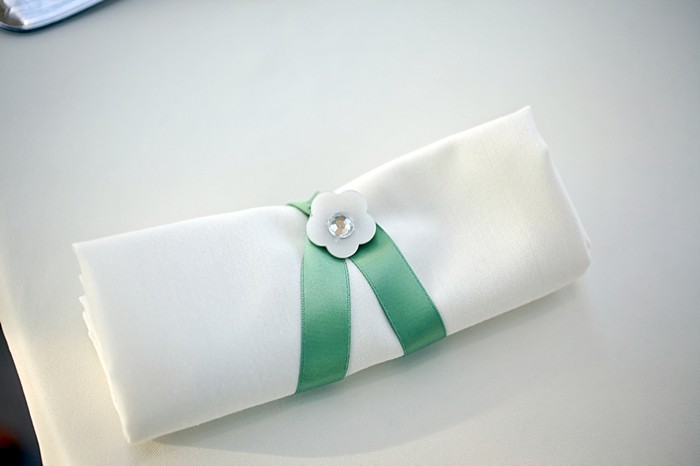 white purse with mint ribbon