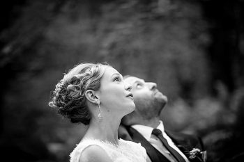 bride and groom look up