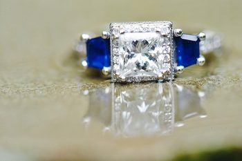 diamond engagement ring with sapphire accent