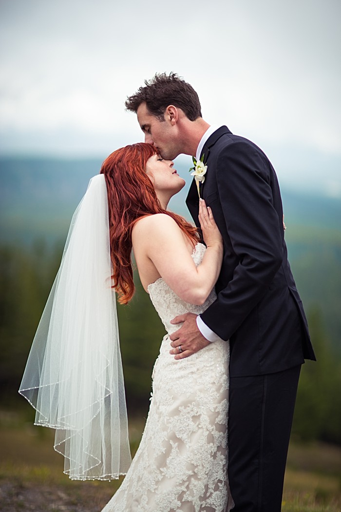 sweet moment between mountain bride and groom| Banff Wedding by Just for You Photography