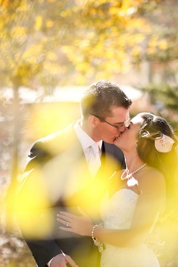 18b-Devils-Thumb-Ranch-wedding-Becky-Young Photography-fall-leaves-kiss