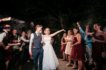 exit throwing rice western North Carolina handmade wedding by Shutter Love Photography