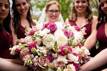 bridesmaids in maroon dresses with bouquets western North Carolina handmade wedding by Shutter Love Photography