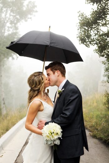 bride and groom under an umbrella | Snowbird Utah Wedding Logan Walker Photography