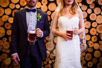 bride and groom with beer portraits | winter Revelstoke wedding | Christina Louise Photography