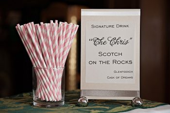 signature cocktail with pink and white paper straws | Lake Louise winter wedding | Orange Girl photography