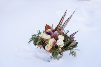 Pheasant feather bouquet | Breckenridge Nordic Wedding Inspiration Bergreen Photography | Via MountainsideBride.com