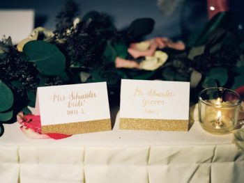 gold glitter placement cards | Copper Mountain Wedding Colorado Danielle DeFiore Photography | Via Mountainsidebride.com
