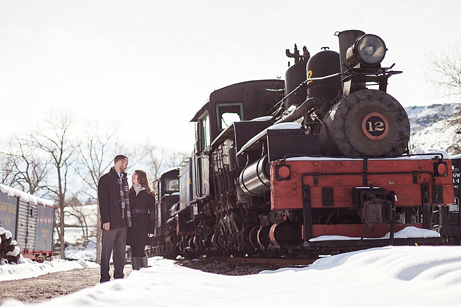 Adventurous Winter Train Station Engagement in the Rocky Mountains
