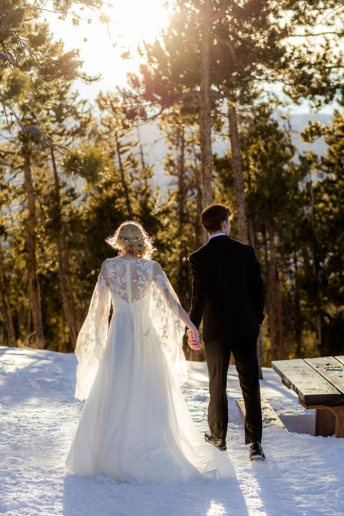 bride in a lace wedding dress with groom