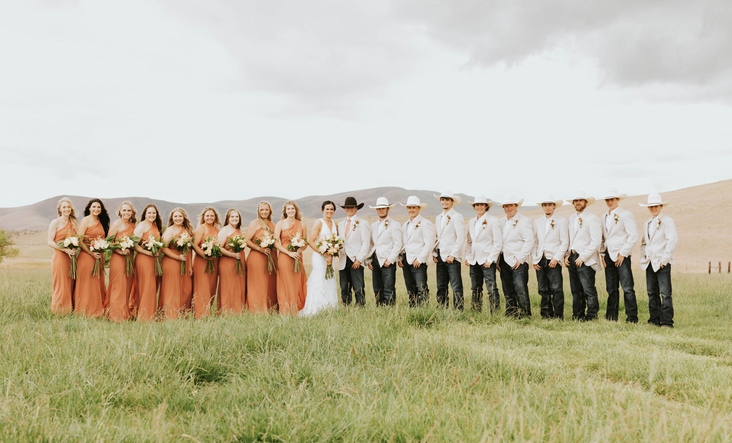 bride, bridal party and groom in a rustic mountain wedding